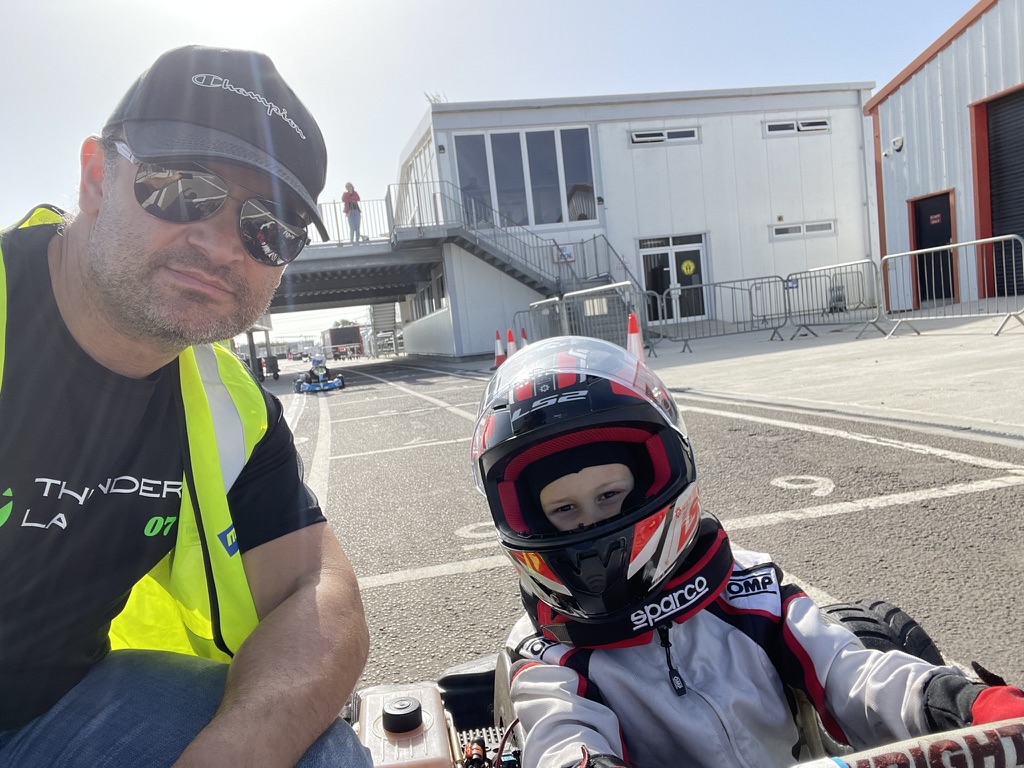Father and son in the paddock