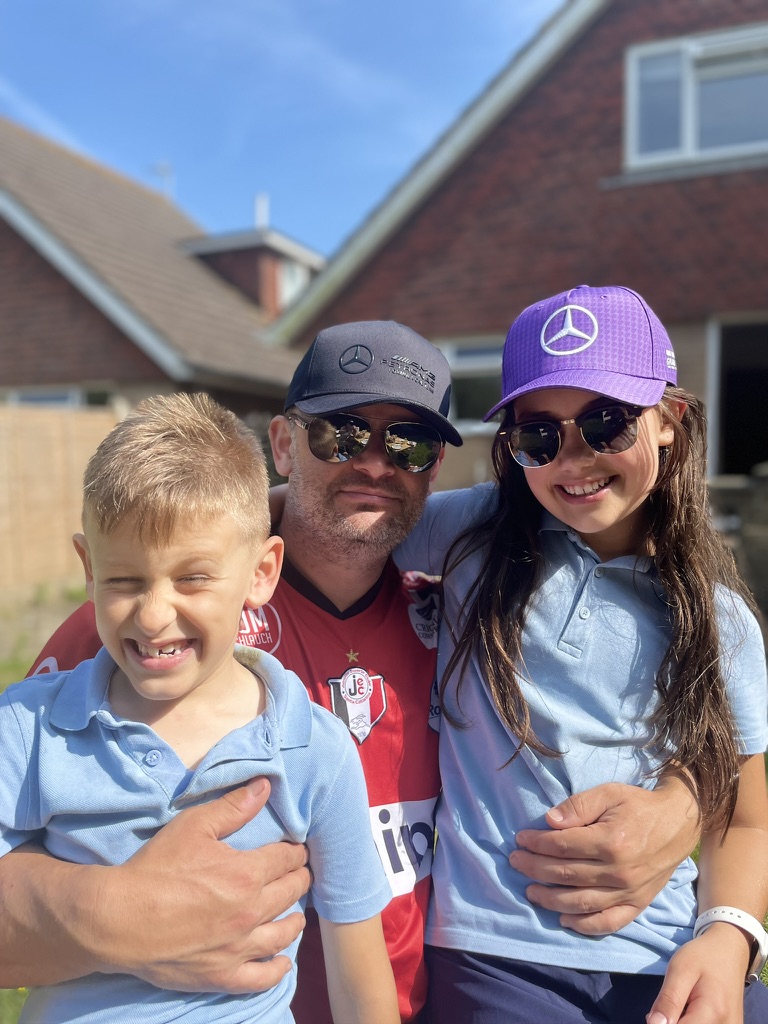 Enrique with his dad and sister