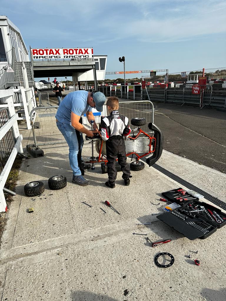 Dad and Enrique working on the kart