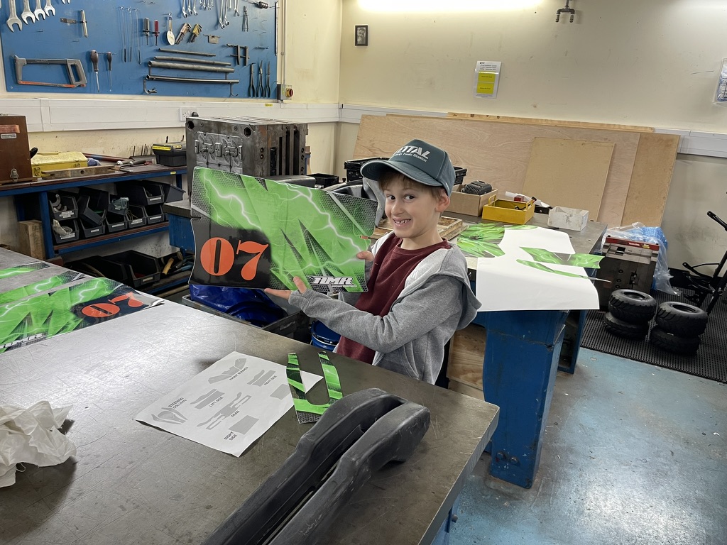 Holding his own kart bodywork